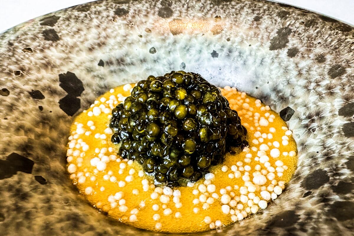 A course of caviar and rice with puffed sesame at Addison restaurant in the Fairmont Grand Del Mar.