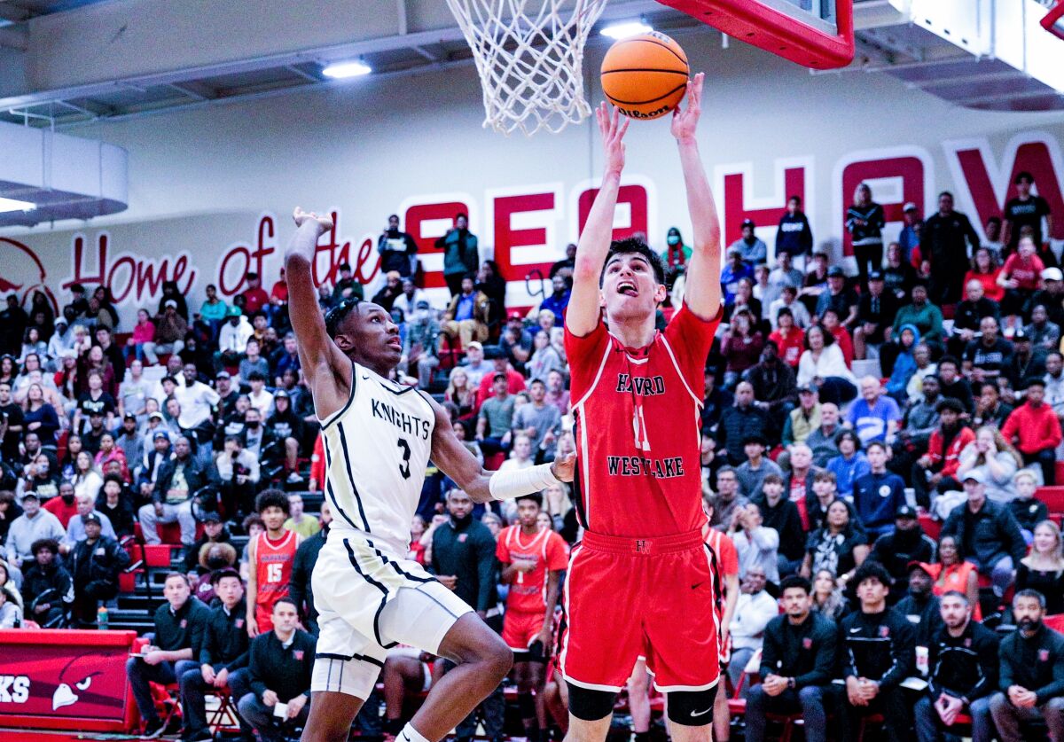 Harvard-Westlake forward Brady Dunlap looks to score inside against Bishop Montgomery guard Christian Jones.