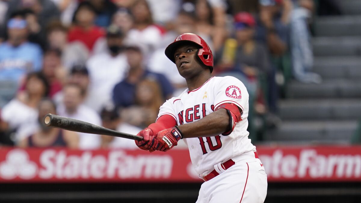 Angels veteran Justin Upton watches the flight of the ball he just hit.