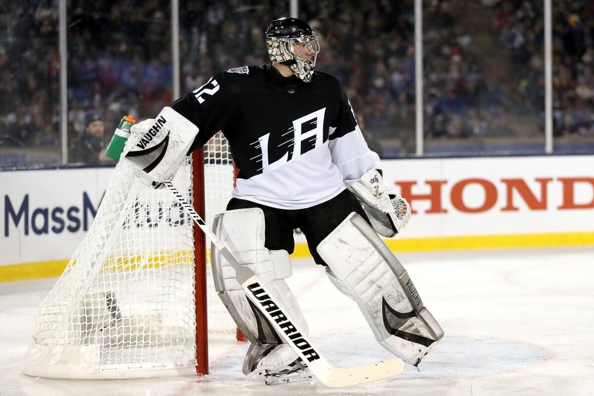 Kings goaltender Jonathan Quick stands at his net during the outdoor game at the Air Force Academy.