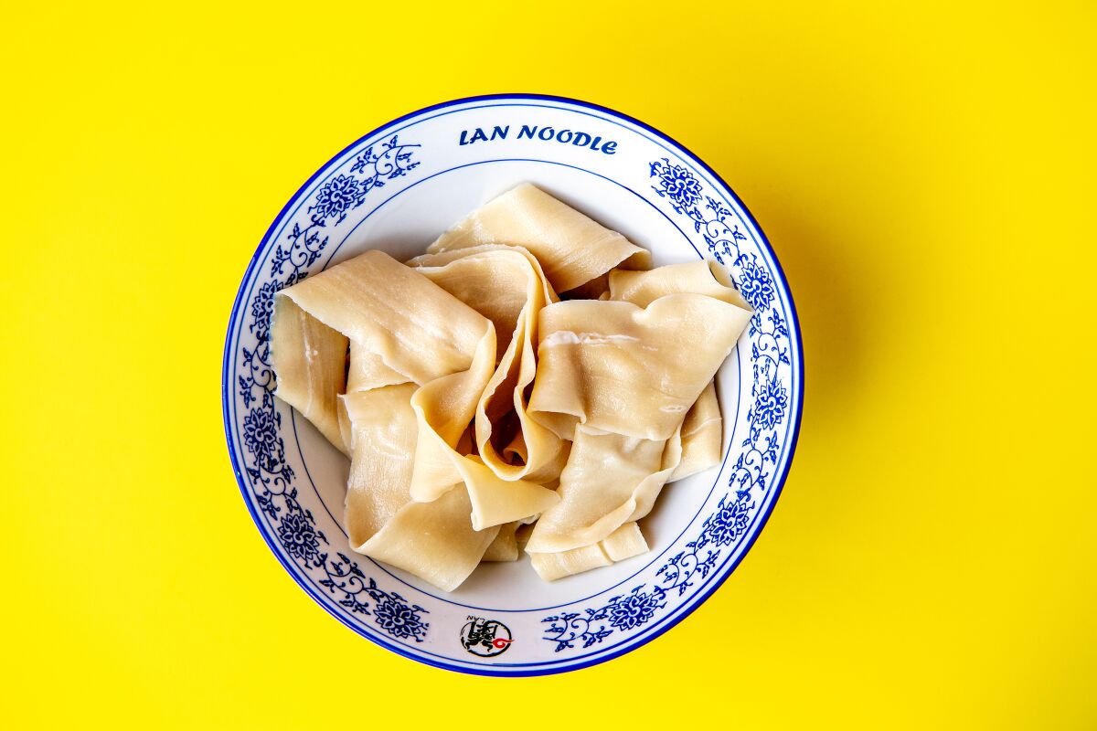 The wide flat longevity noodle from LAN Noodle.