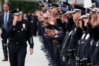 Los Angeles, California February 29, 2024-LAPD Chief Michael Moore greets officers during a ceremonial Honor Cordon outside LAPD headquarters Thursday. (Wally Skalij/Los Angeles Times)