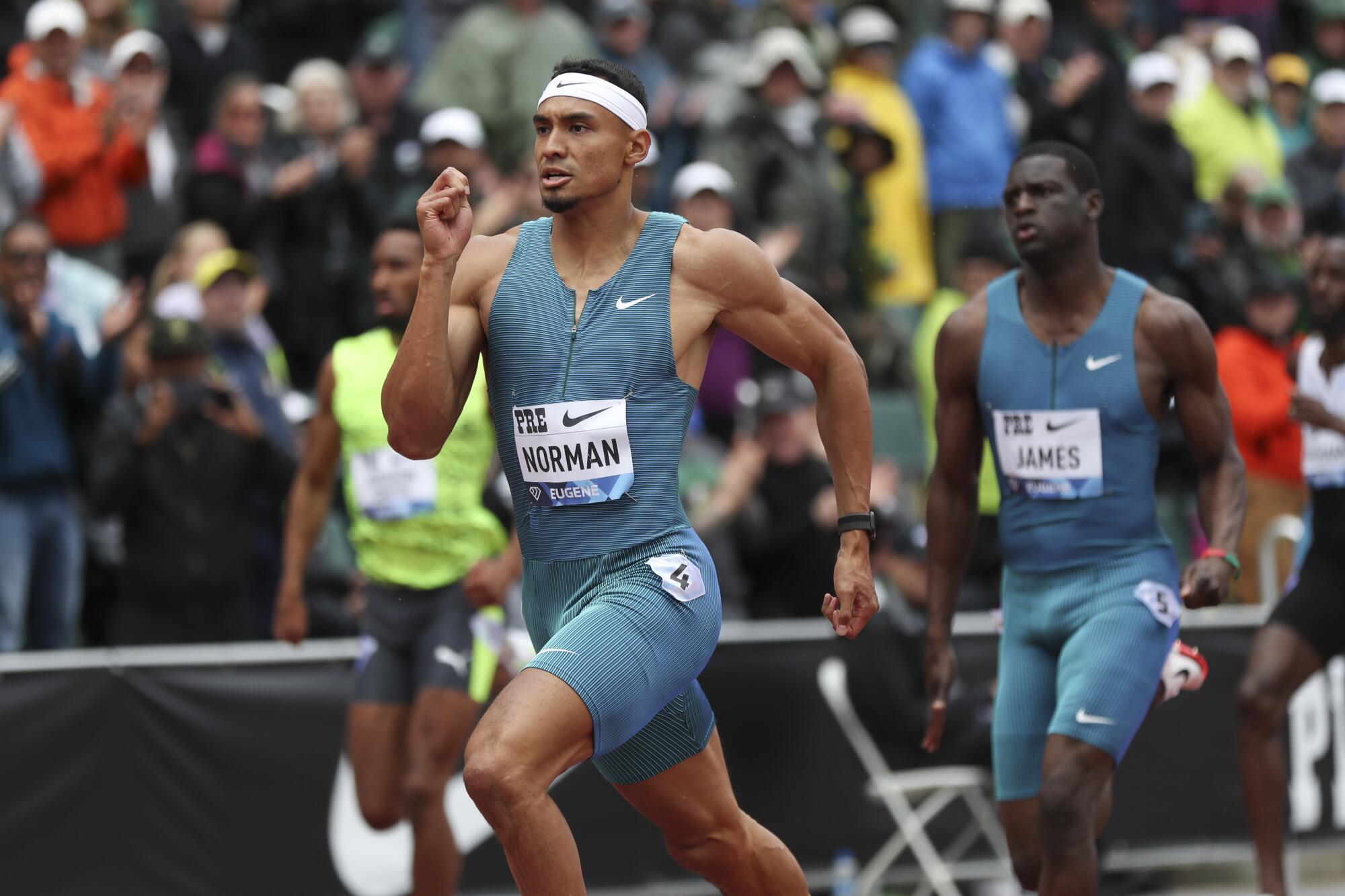 United States' Michael Norman, center, runs in the men's 400 meters during the Prefontaine Classic.