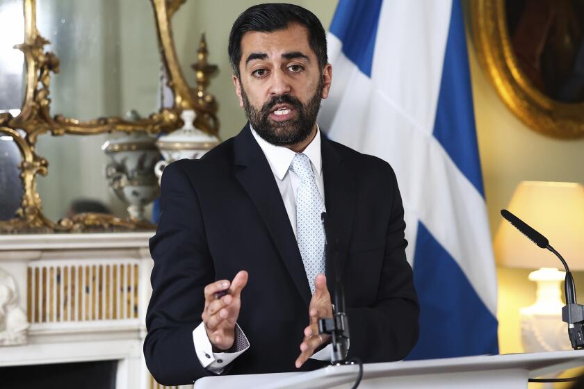 Scotland's First Minister Humza Yousaf speaks during a press conference at Bute House, Edinburgh, Thursday, April 25, 2024. Scotland’s leader is facing a potential battle for survival after ending a three-year power-sharing agreement with the Scottish Green Party following a clash over climate change policies. First Minister Humza Yousaf of the Scottish National Party informed the leaders of the much smaller Greens on Thursday that he was terminating the power-sharing agreement. (Jeff J Mitchell/PA via AP)