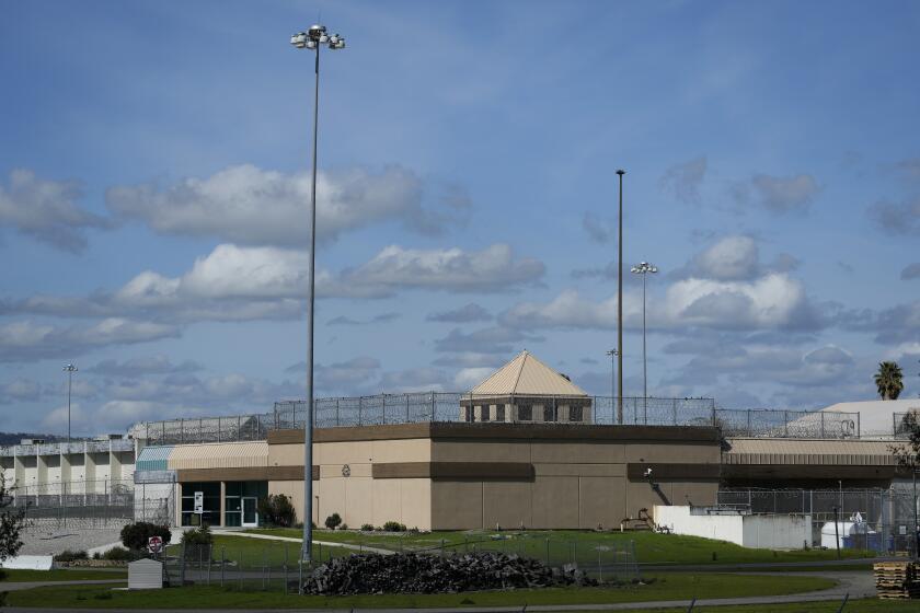 A section of the Federal Correctional Institution is shown in Dublin, Calif., Monday, March 11, 2024. Federal investigators on Monday were again searching a troubled women's prison in California, seizing computers and documents in an apparent escalation of a yearslong sexual abuse investigation that previously led to charges against a former warden and other employees. (AP Photo/Jeff Chiu)