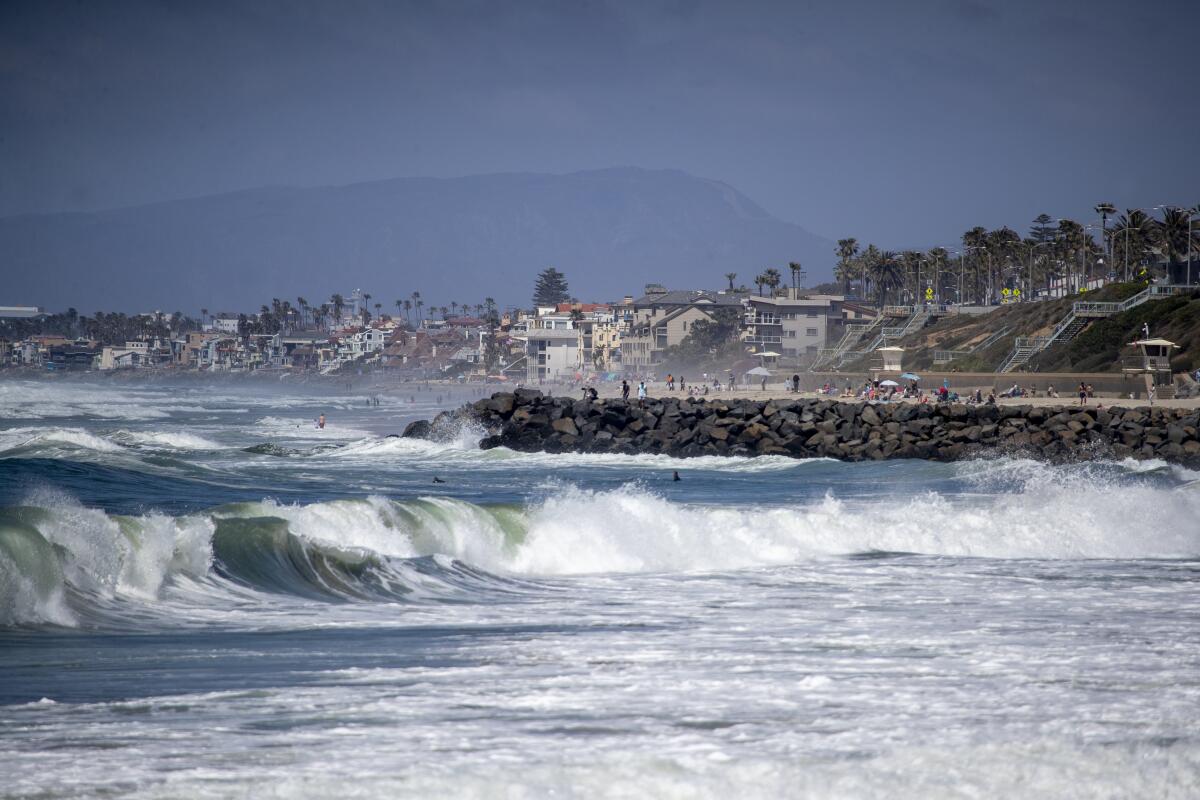 A jetty protrudes into the Pacific Ocean in Carlsbad.