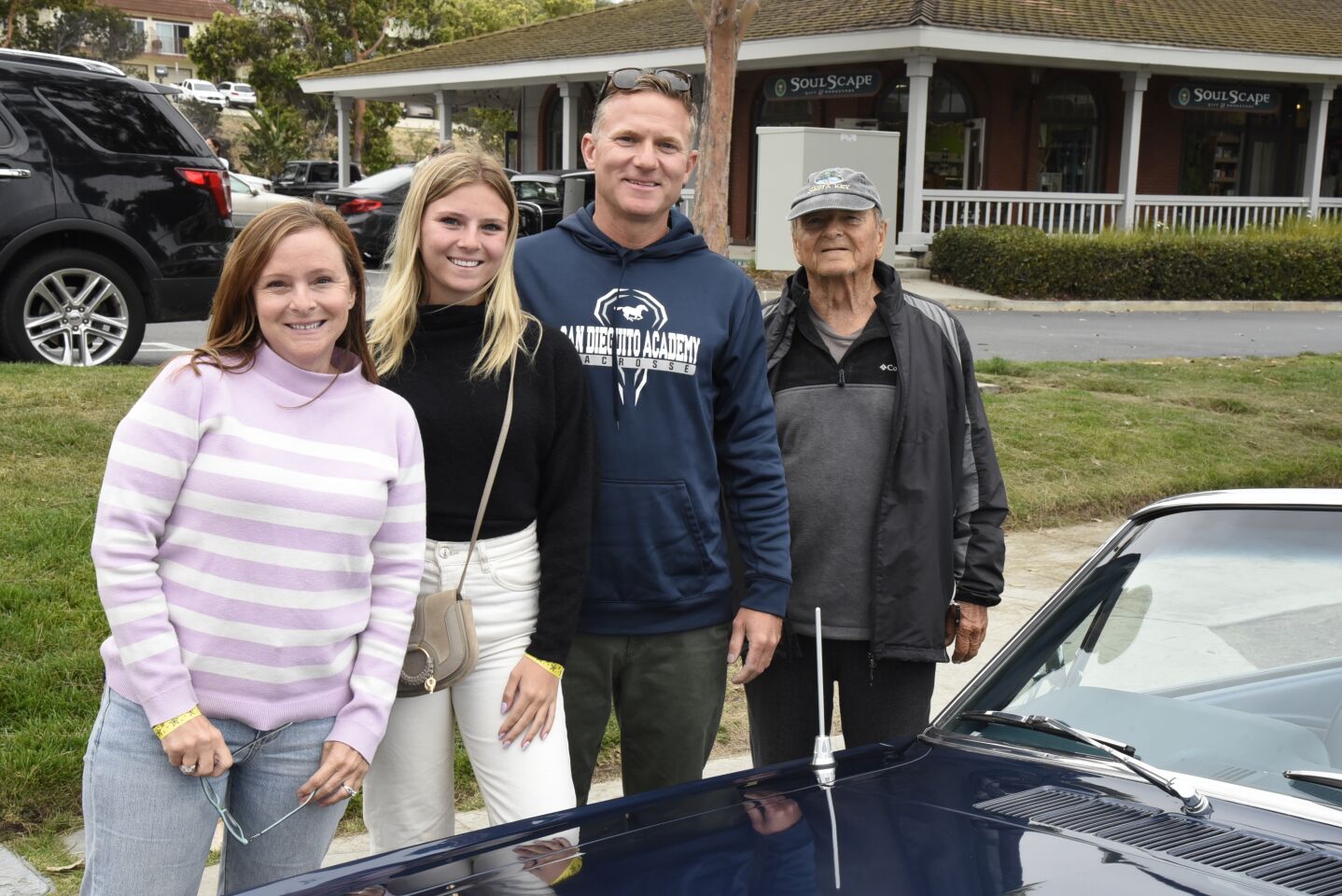 Jenny Whibbs, Maggie Whibbs, Vinnie Whibbs, David Babcock, with their classic Mustang