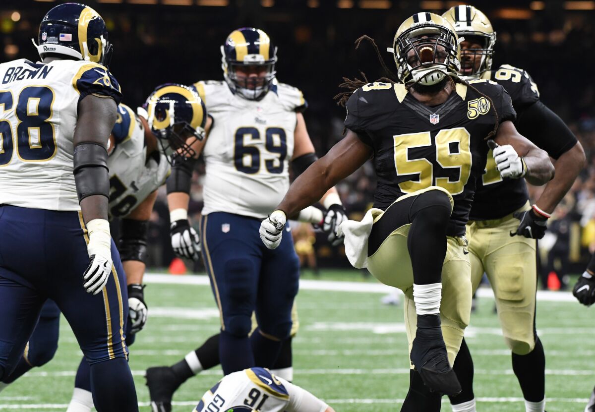 Saints linebacker Dannell Ellerbe celebrates after sacking Rams quarterback Jared Goff during the fourth quarter of Sunday's game.