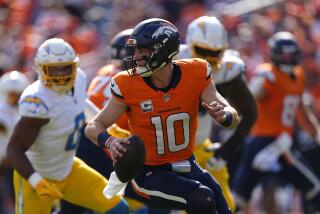 Denver Broncos quarterback Bo Nix (10) scrambles against the Chargers defense.