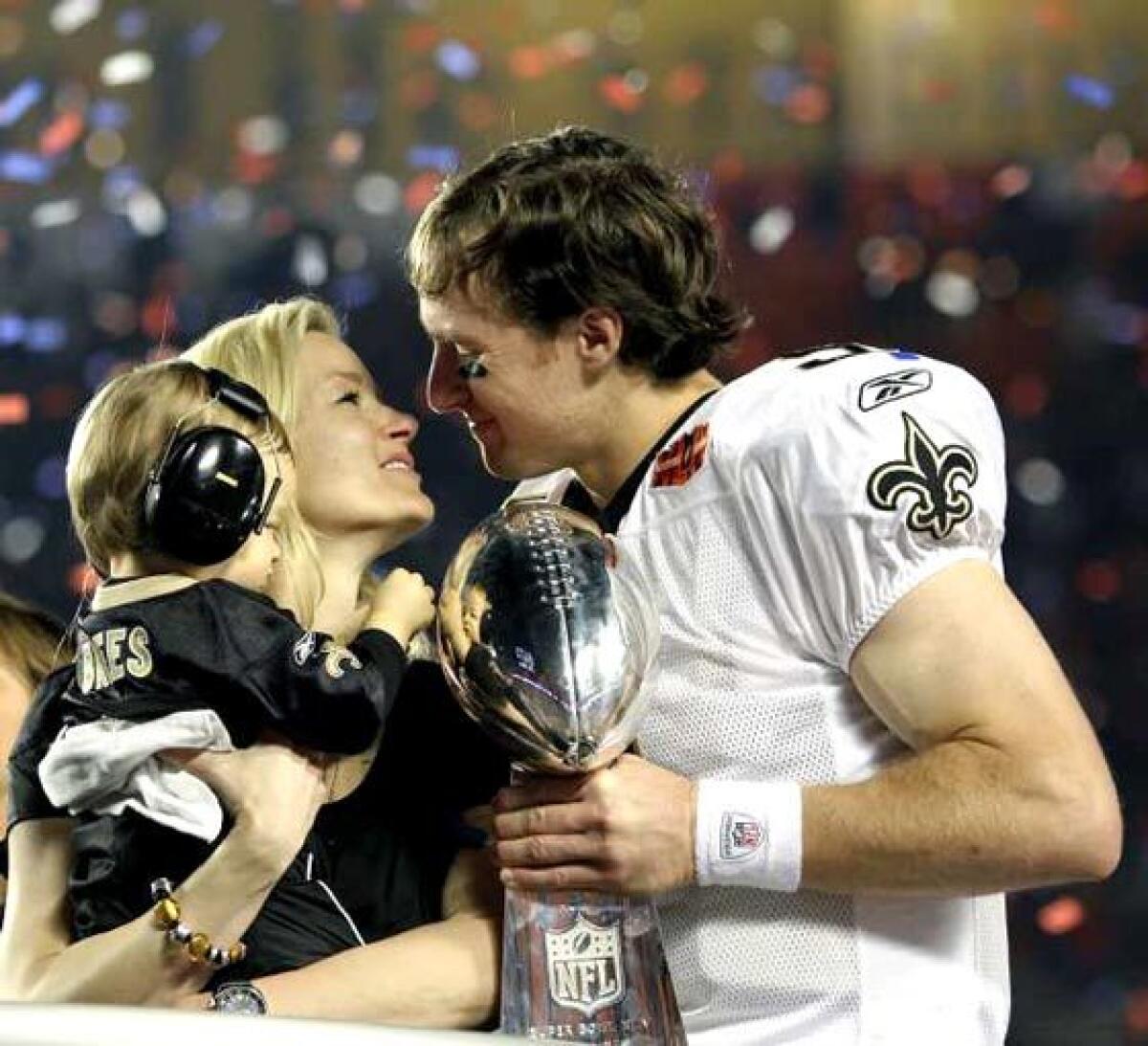 Drew and Brittany Brees celebrate the New Orleans Saints' Super Bowl victory over the Indianapolis Colts on Feb. 7, 2010.