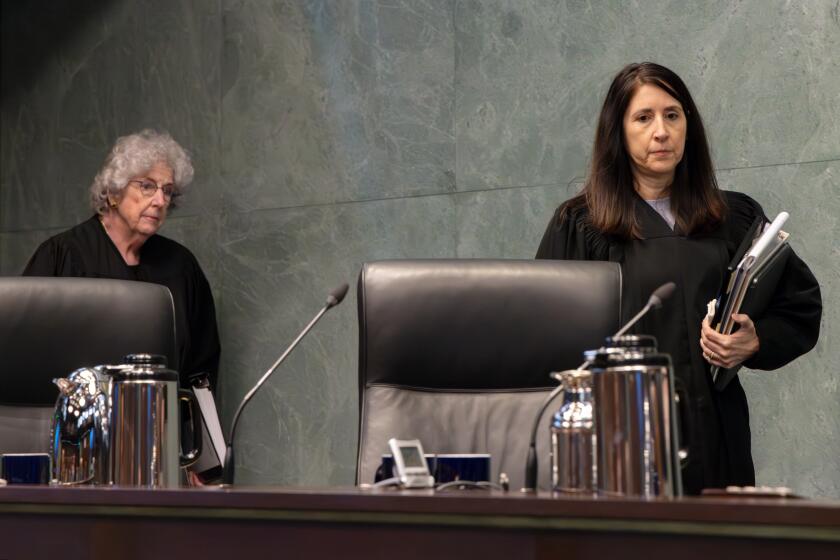 LOS ANGELES, CA - DECEMBER 05: Justice Carol A. Corrigan, left, and Chief Justice Patricia Guerrero at California Supreme Court's session in Los Angeles first time since before pandemic, in North Tower of Ronald Reagan State Office Building on Tuesday, Dec. 5, 2023 in Los Angeles, CA. (Irfan Khan / Los Angeles Times)