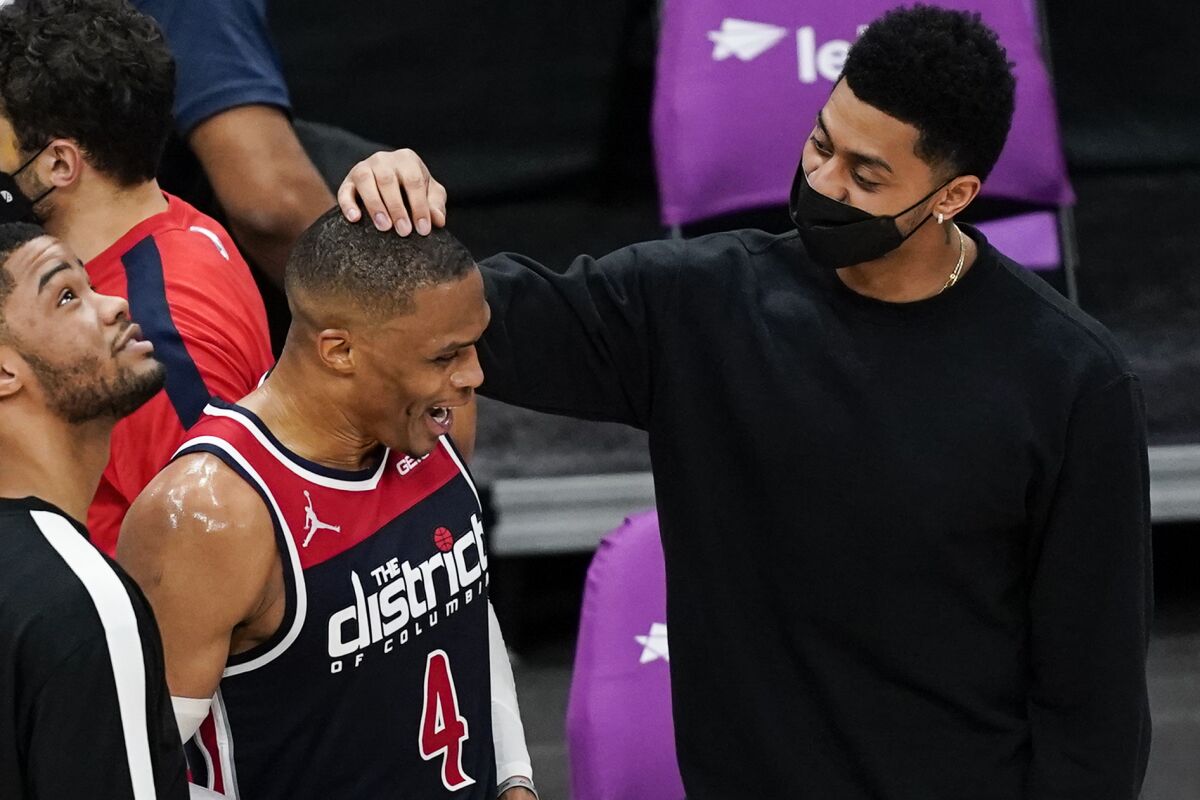 Washington Wizards guard Russell Westbrook (4) talks with Indiana Pacers' Jeremy Lamb, right, after a basketball game, Monday, May 3, 2021, in Washington. The Wizards won 154-141. (AP Photo/Alex Brandon)