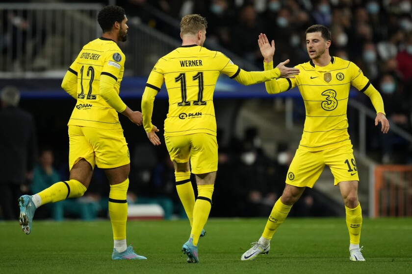 Chelsea's Mason Mount, right, celebrates with his teammates after he scored his side's first goal during the Champions League, quarterfinal second leg soccer match between Real Madrid and Chelsea at the Santiago Bernabeu stadium in Madrid, Spain, Tuesday, April 12, 2022. (AP Photo/Manu Fernandez)