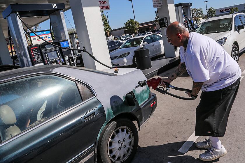 Jorge Garcia fills his tank at Costco.