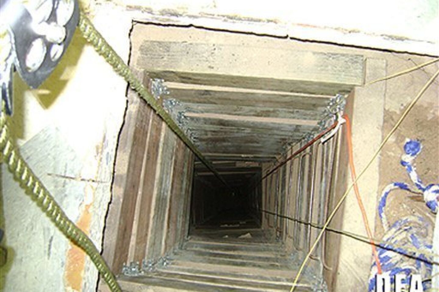 In this undated photo provided by the United States Drug Enforcement Administration, shows the tunnel shaft entrance on the U.S. side of a 240-yard, complete and fully operational drug smuggling tunnel that ran from a small business in Arizona to an ice plant on the Mexico side of the border, Thurs