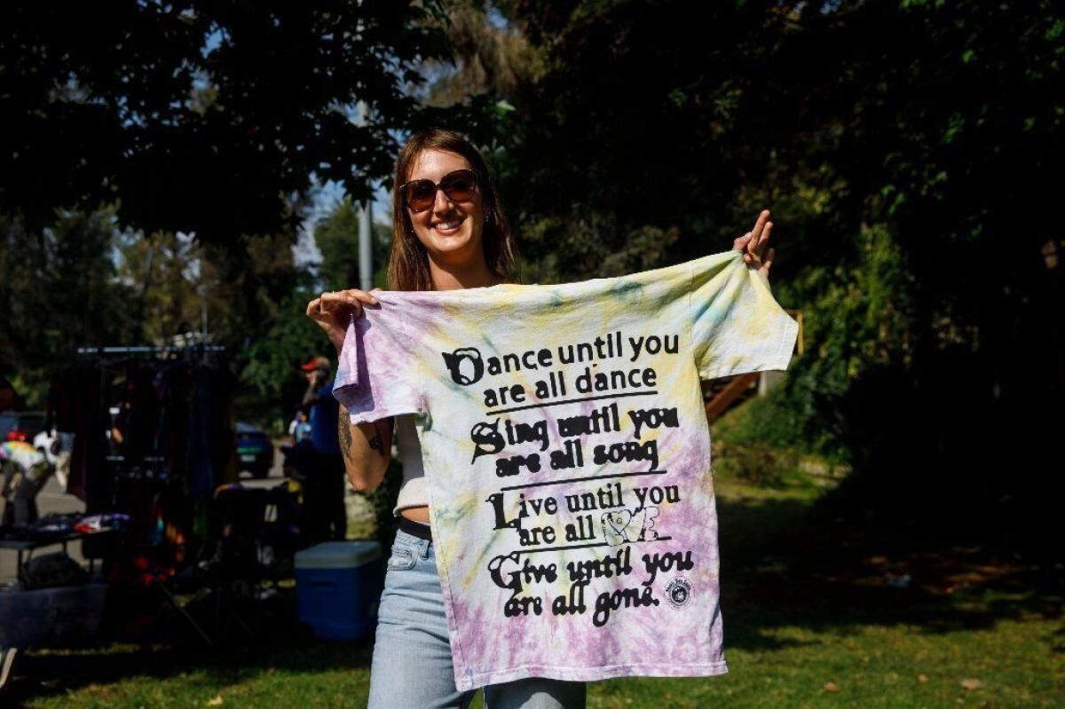 Kyrié Joyce, a 29-year-old artist from Brooklyn who will be selling her own shirts outside Dead shows throughout this summer tour, picked up an Online Ceramics T-shirt before the concert at the Hollywood Bowl.