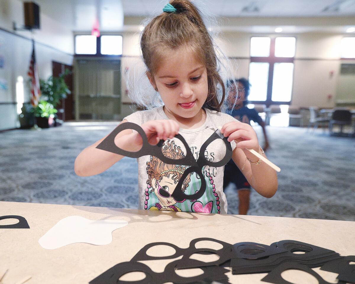Photo Gallery: Sock Hop at Buena Vista Branch Library for young children to gather donated socks for Ascencia in Glendale