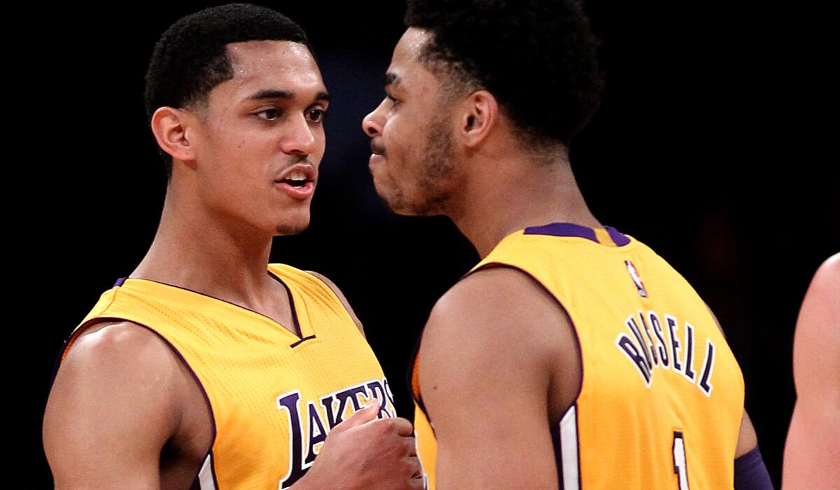 Lakers guards Jordan Clarkson and D'Angelo Russell celebrate during the second half of a 107-98 victory over the Magic on March 8.
