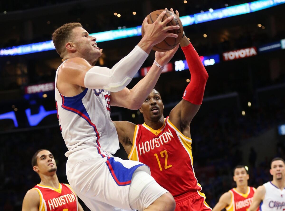 Blake Griffin goes up for a shot against Houston's Dwight Howard on Sunday night.