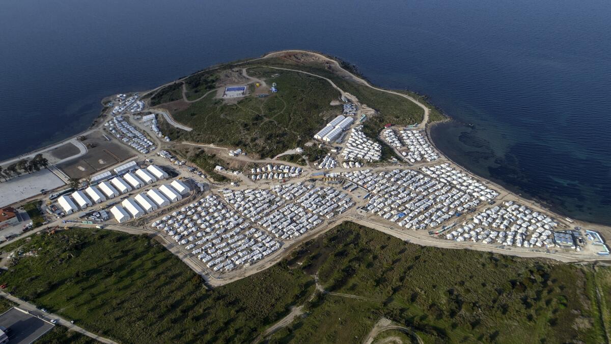 FILE - In this file photo dated Monday, March 29, 2021, a general view from above Karatepe refugee camp, on the eastern Aegean island of Lesbos, Greece. Greek authorities on island of Lesbos said Tuesday July 20, 2021, they are drawing up a criminal case, including on charges of espionage, against 10 people, all foreign nationals, for allegedly helping migrants enter the country illegally. No suspects have been publicly identified. (AP Photo/Panagiotis Balaskas, FILE)