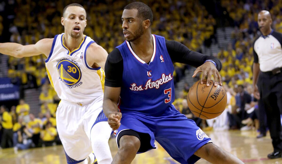 Clippers point guard Chris Paul drives against Warriors point guard Stephen Curry in the first half of Game 4 on Sunday in Oakland.