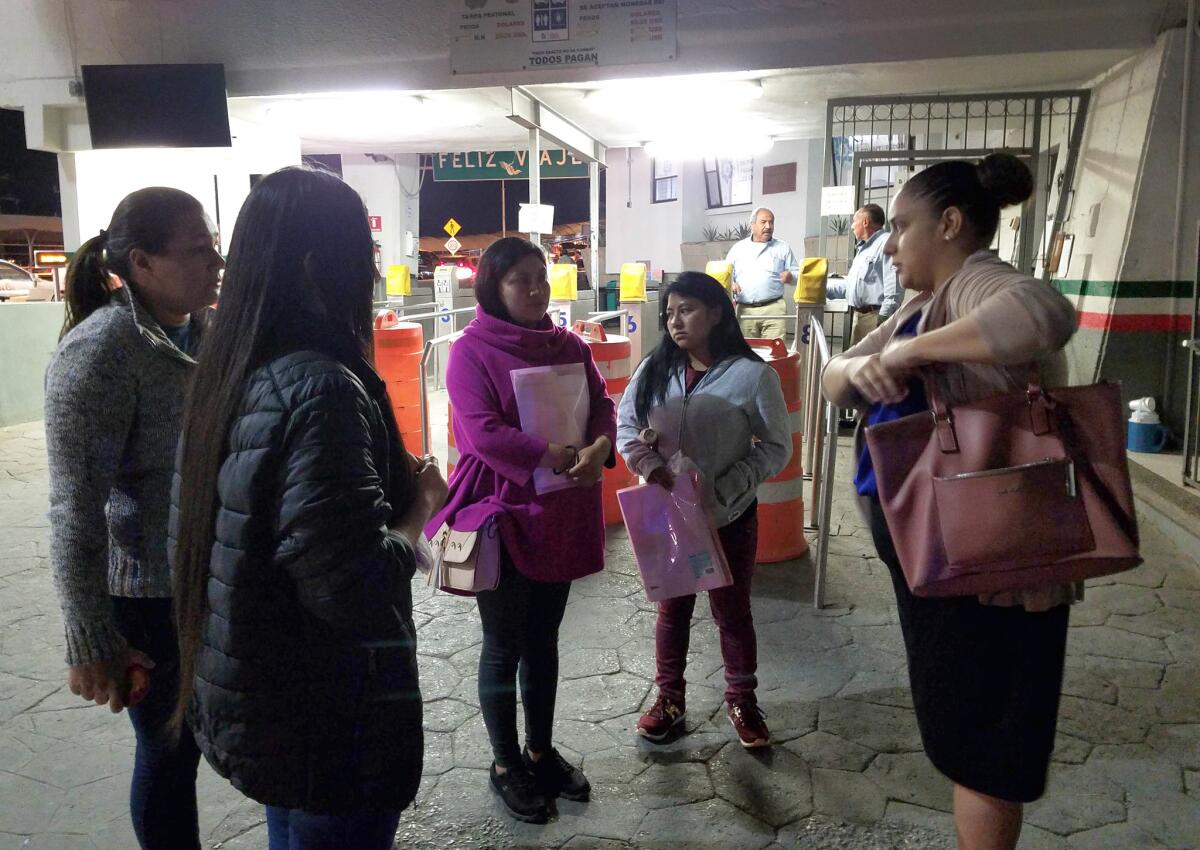 Linda Rivas, right, executive director of El Paso-based Las Americas Immigrant Advocacy Center, helps Guatemalan migrant Enma Hernandez, center, and several other pregnant women in Ciudad Juarez, Mexico.