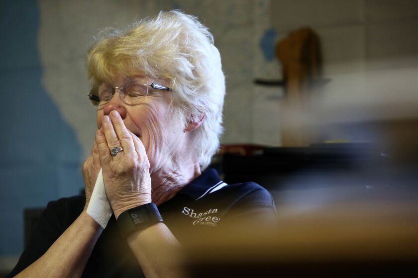 Dianne Franklin, 71, owner of logging company Shasta Green Inc., cries when talking about what will happen to her employees if a neighboring biomass plant closes.