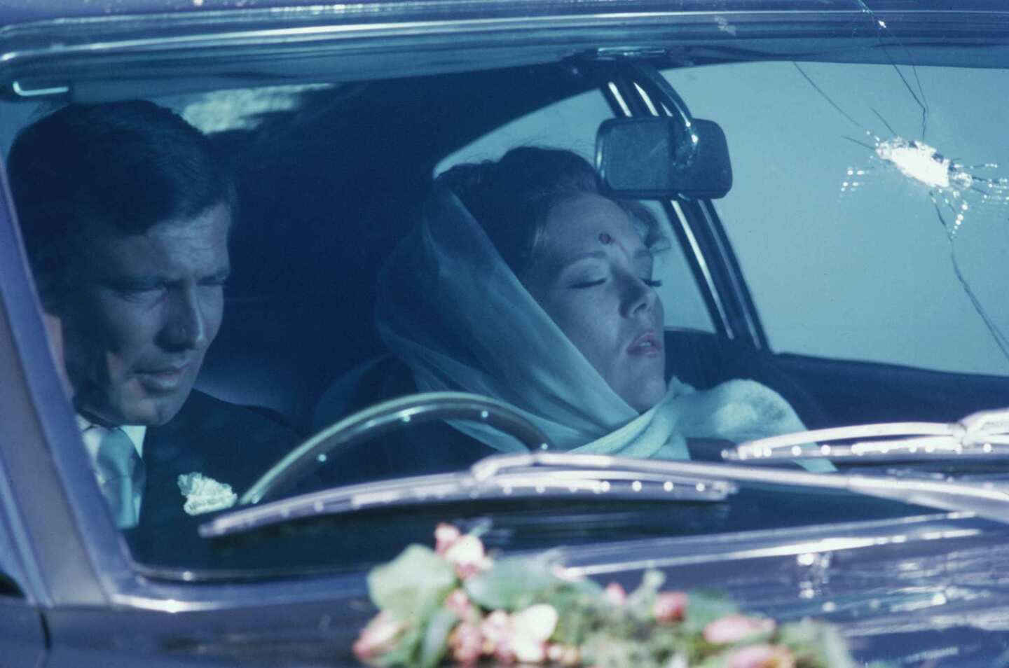 An Aston Martin DBS figures in what may be the most tragic scene in a 007 film. James Bond (George Lazenby) and his bride Tracy (Diana Rigg) are parked on the roadside after their wedding when they're shot at by henchwoman Irma Bunt from a car driven by nemesis Ernst Stavro Blofeld. Bond, thinking they've both survived the attack, climbs inside to find that Tracy has been killed.