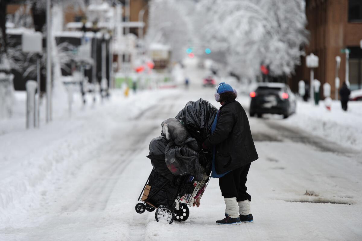 A homeless woman in Portland, Ore., where an extreme cold spell has killed at least four homeless people this month.