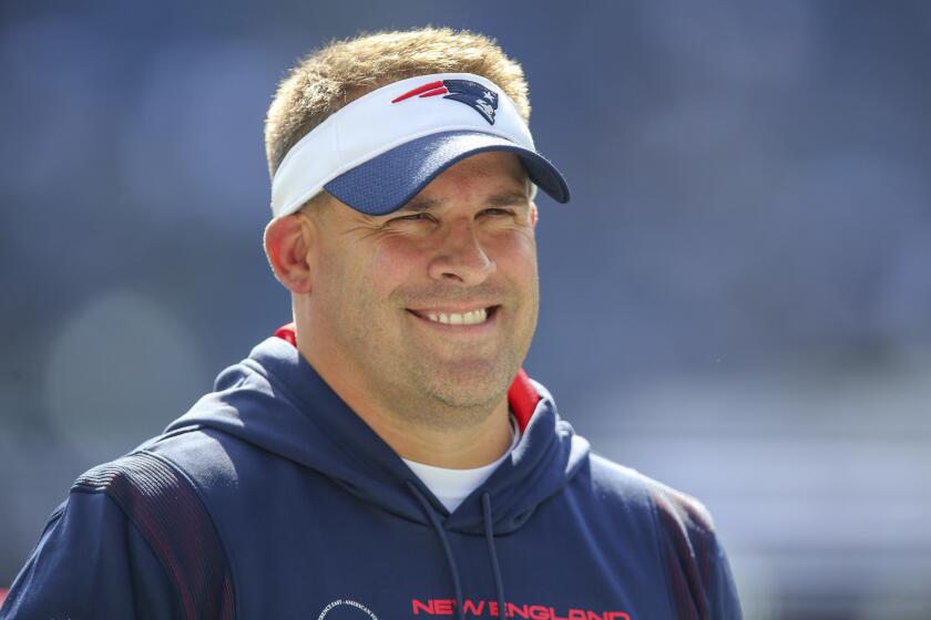 New England Patriots offensive coordinator Josh McDaniels on the field prior to an NFL football game against the New Orleans Saints, Sunday, Sept. 26, 2021, in Foxborough, Mass. (AP Photo/Stew Milne)