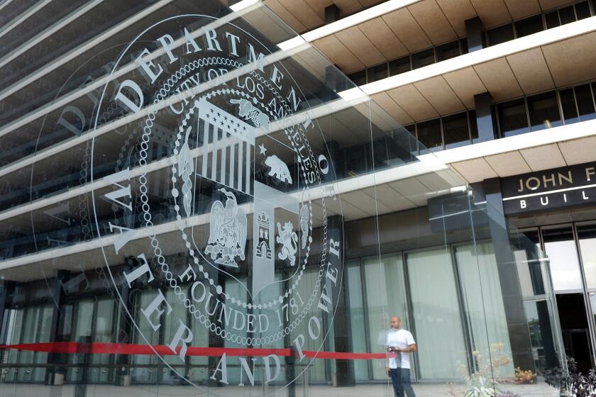 This Wednesday, March 18, 2015 photo shows the front of the headquarters of the Los Angeles Department of Water and Power in downtown Los Angeles. The Los Angeles Department of Water and Power lost up to $88 million in commercial billings because of the botched rollout of a computer billing system. (AP Photo/Richard Vogel)