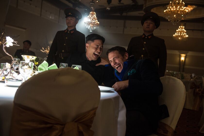 Actors James Franco (right, as Dave Skylark) and Randall Park (as North Korean leader Kim Jong Un) appear in a scene from "The Interview."