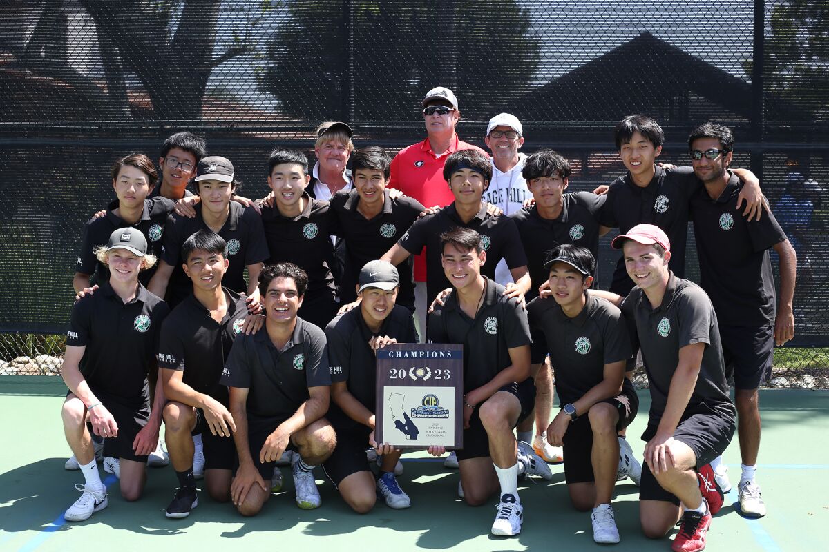 The Sage Hill School boys’ tennis team hoists the CIF championship plaque at the Claremont Club.