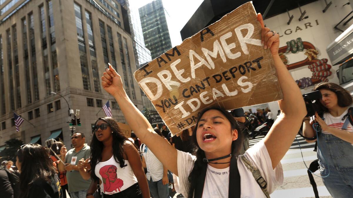 People protest outside Trump Tower in New York in 2017 in opposition to the Trump administration's proposed changes to the Deferred Action for Childhood Arrivals program.