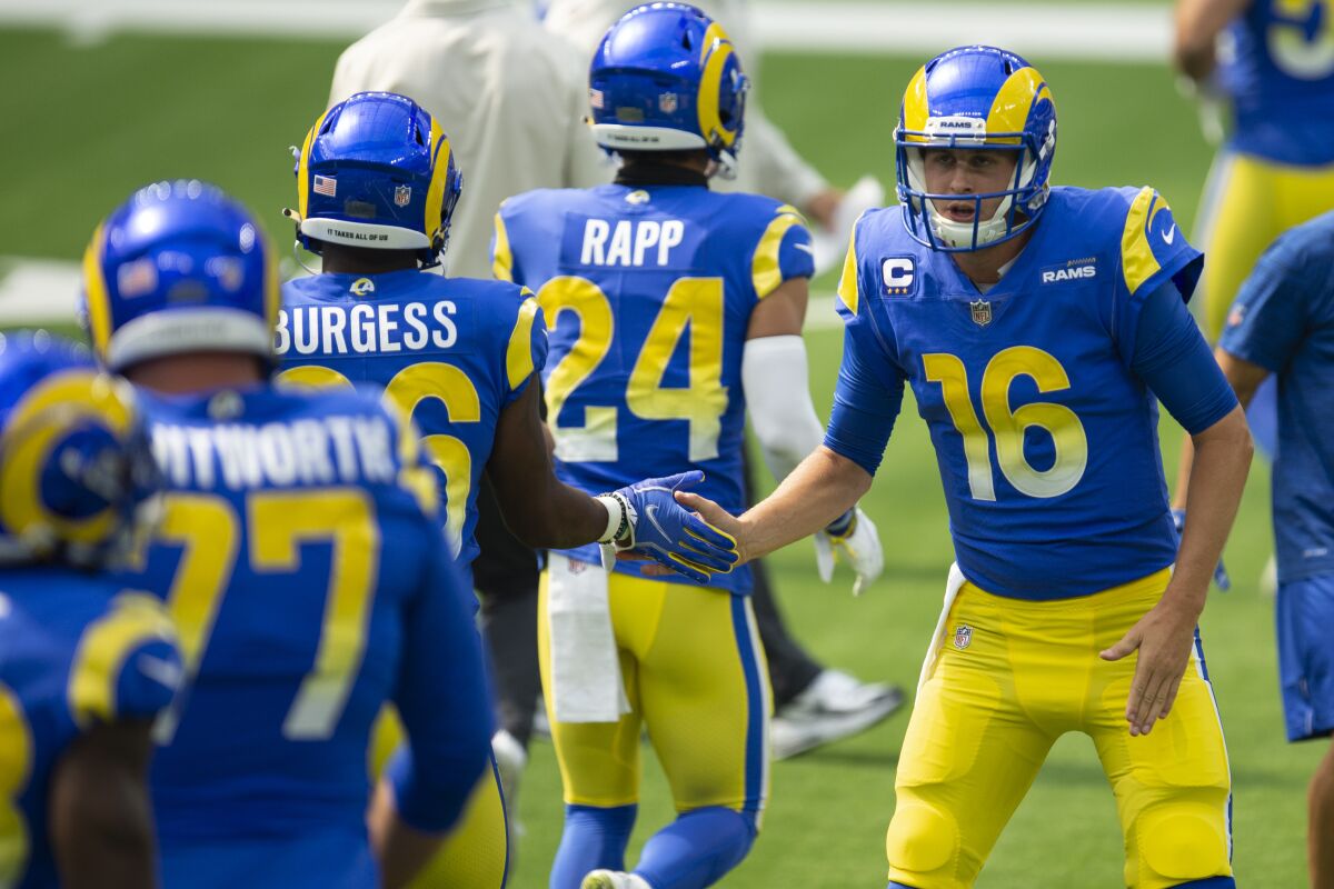 Rams quarterback Jared Goff greets his teammates before a game against the Giants.