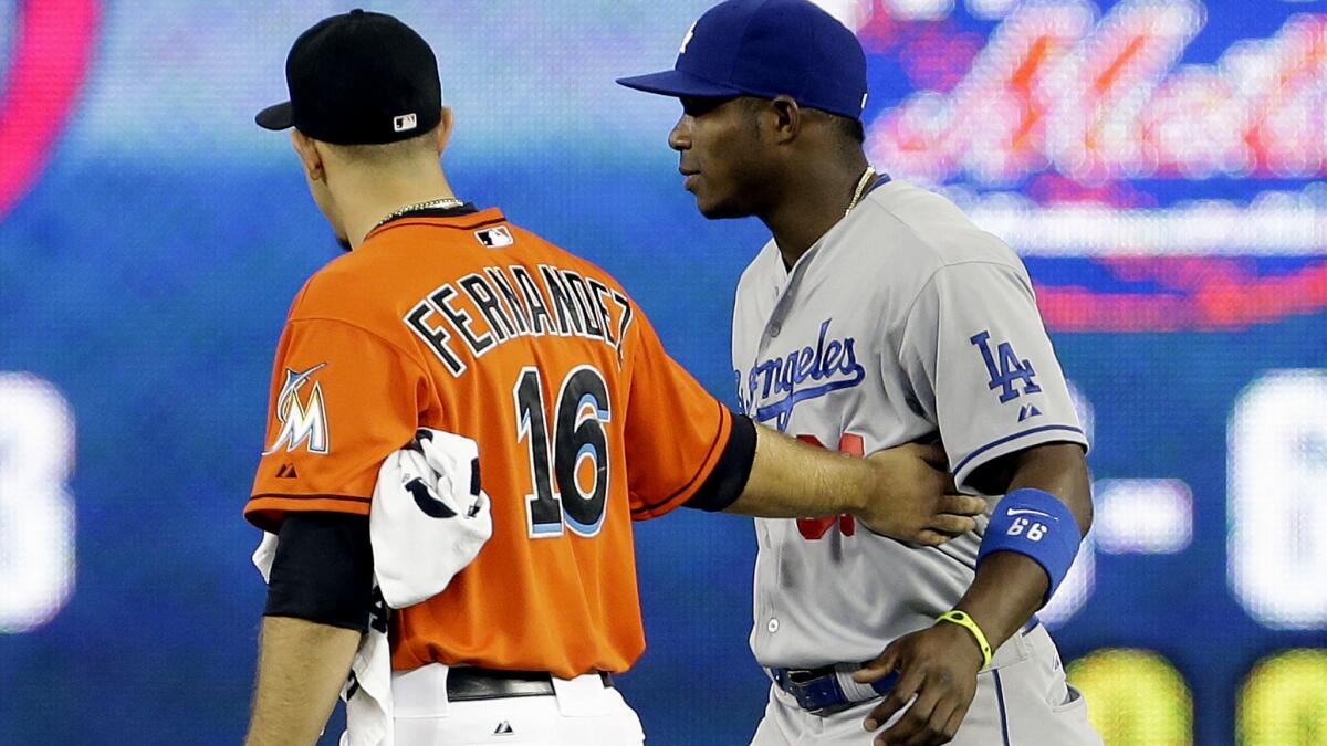 Dodgers outfielder Yasiel Puig greets Marlins pitcher Jose Fernandez before a game in Miami during the 2013 season.