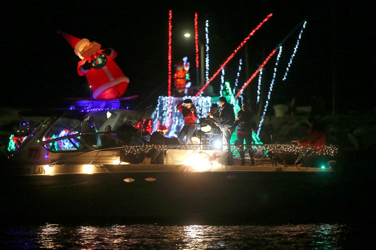 Members of the surf rock band the Nomads play during the 111th Newport Beach Christmas Boat Parade in December.