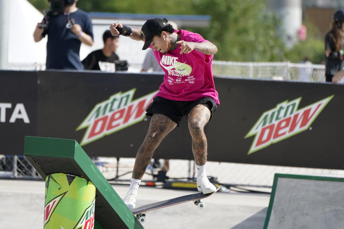 Nyjah Huston competes in the men's Street Final during an Olympic qualifying skateboard event in May.