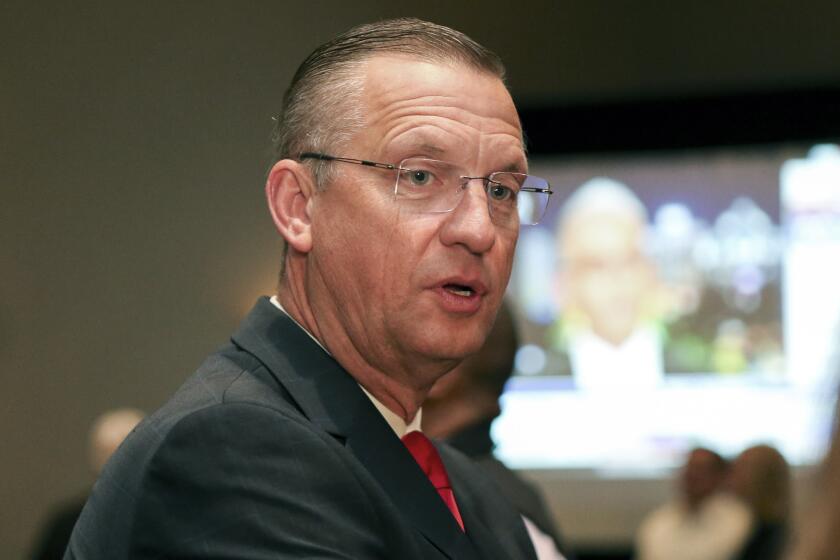 Republican candidate for Senate Rep. Doug Collins attends an election night watch party in Buford, Ga., Tuesday, Nov. 3, 2020. (AP Photo/Brett Davis)