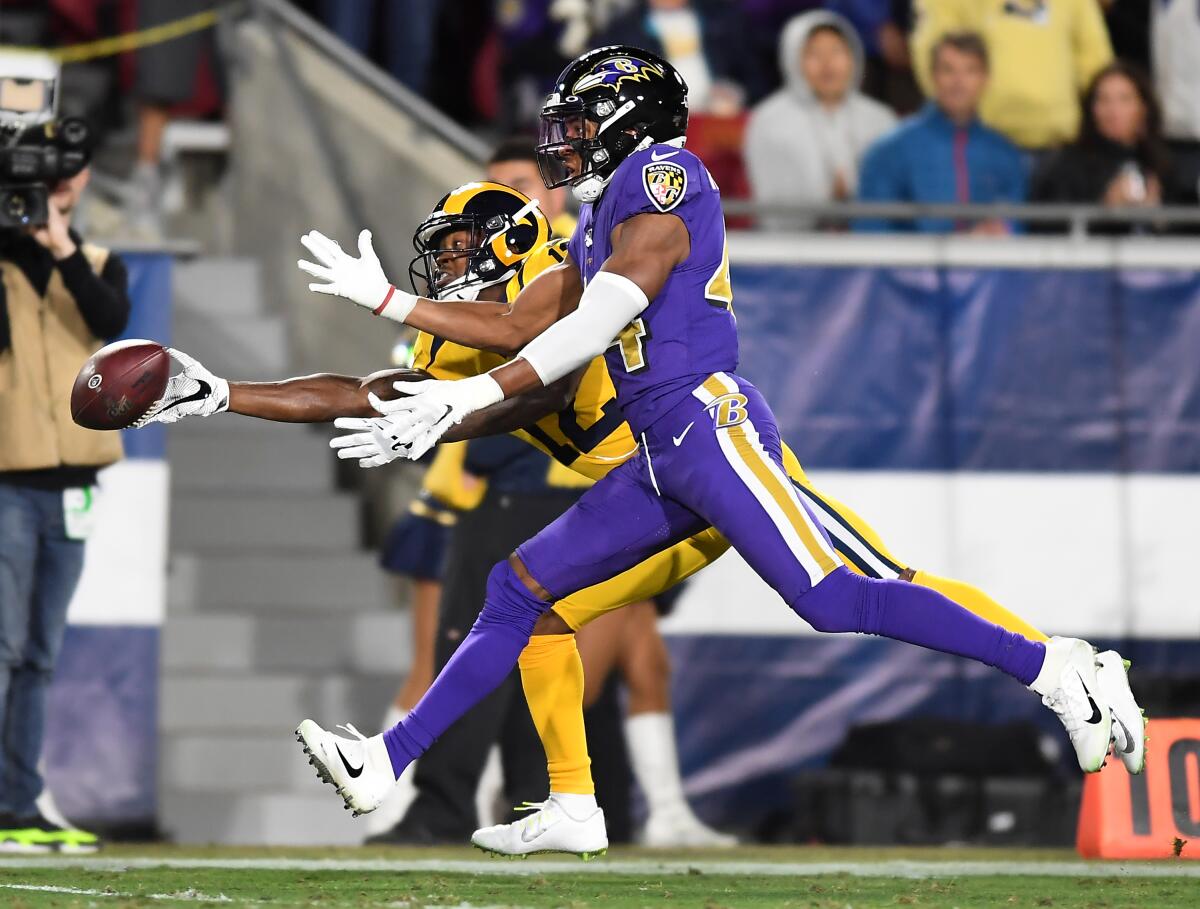 Rams receiver Robert Woods can't make a catch against Baltimore Ravens cornerback Marlon Humphrey.