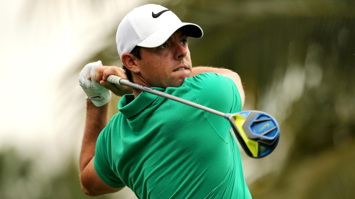 Rory McIlroy watches his tee shot at No. 12 during the third round of the WGC Cadillac Championship on Saturday.