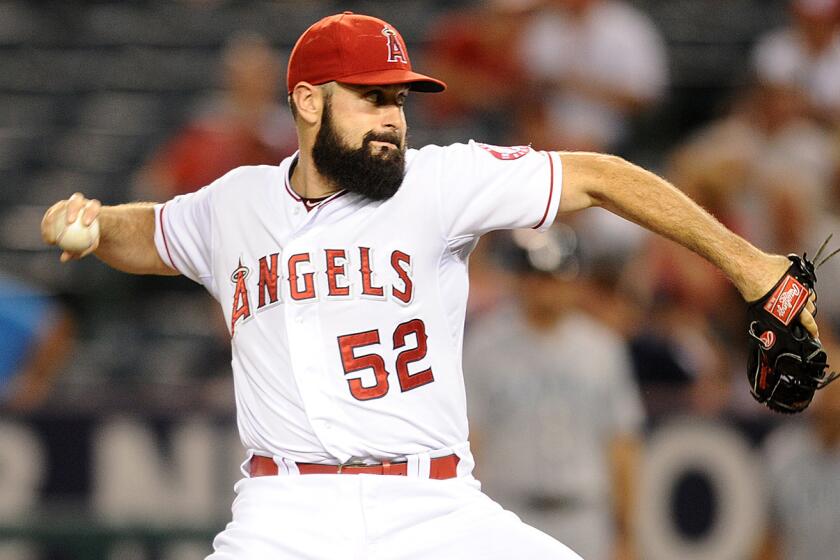 Angels starter Matt Shoemaker delivers a pitch during Monday's game against the Seattle Mariners.