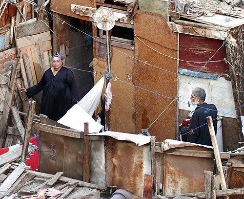 Alia Qotb, left, and her husband, Ahmed Gaballah, call this rooftop in Cairo home. The poor make up nearly half of Egypts population of 73 million.
