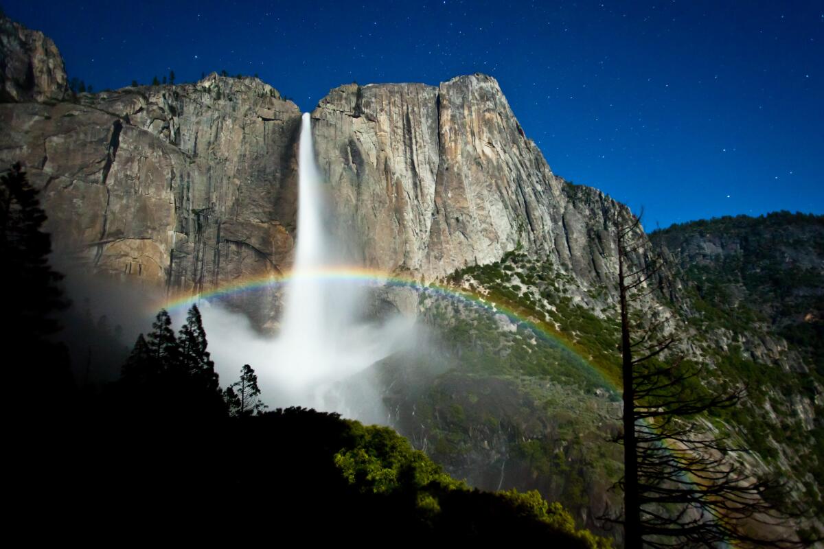 Moonbow (lunar rainbow) forms in the mist near Upper Yosemite Fall on a clear night just before a full moon in 2011.