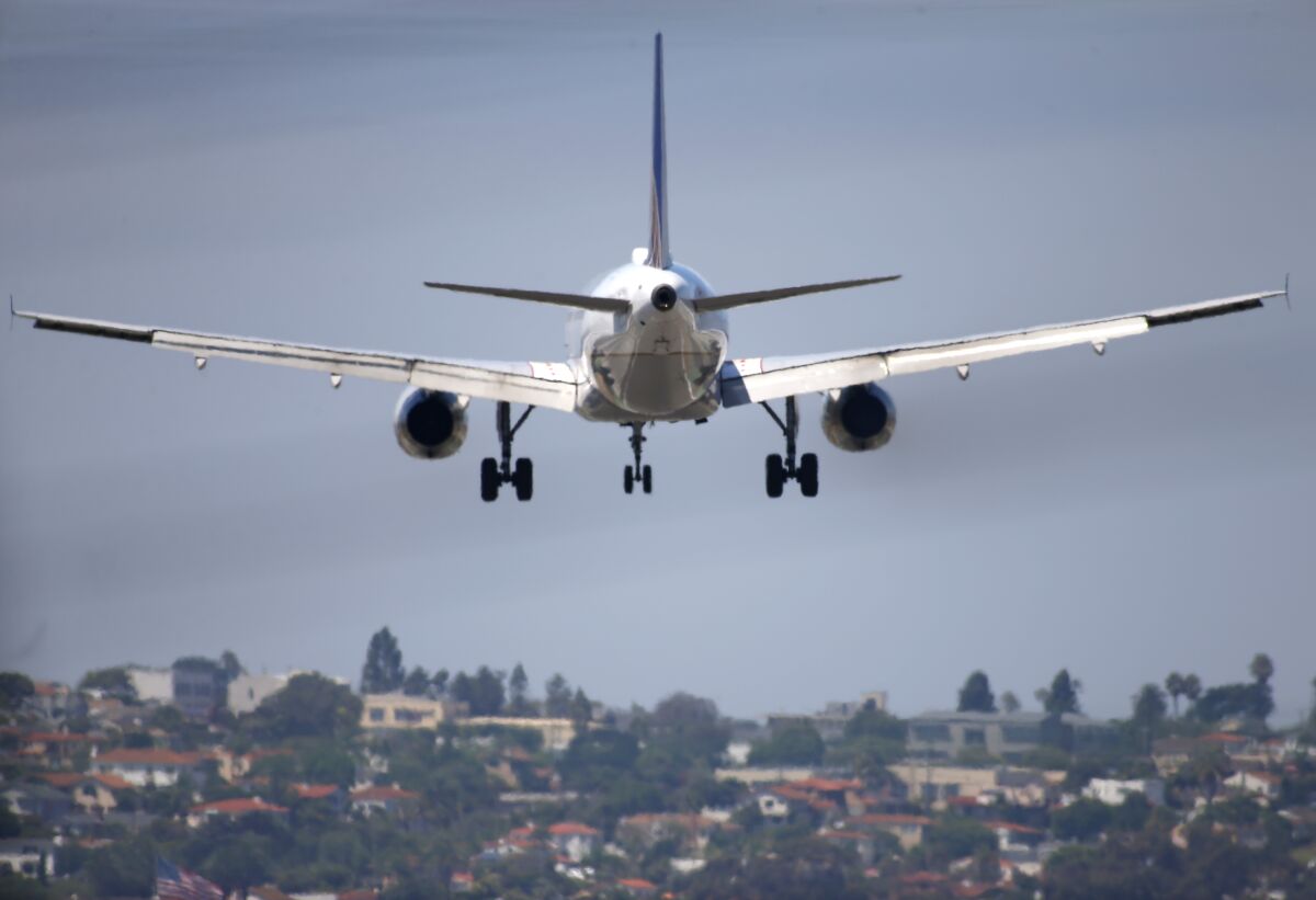 A United Airlines jet approaches San Diego International Airport for a landing.