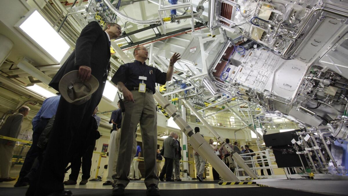 Two scientists in the target bay of the National Ignition Facility at the Lawrence Livermore National Laboratory in Livermore, Calif. on May 29, 2009.