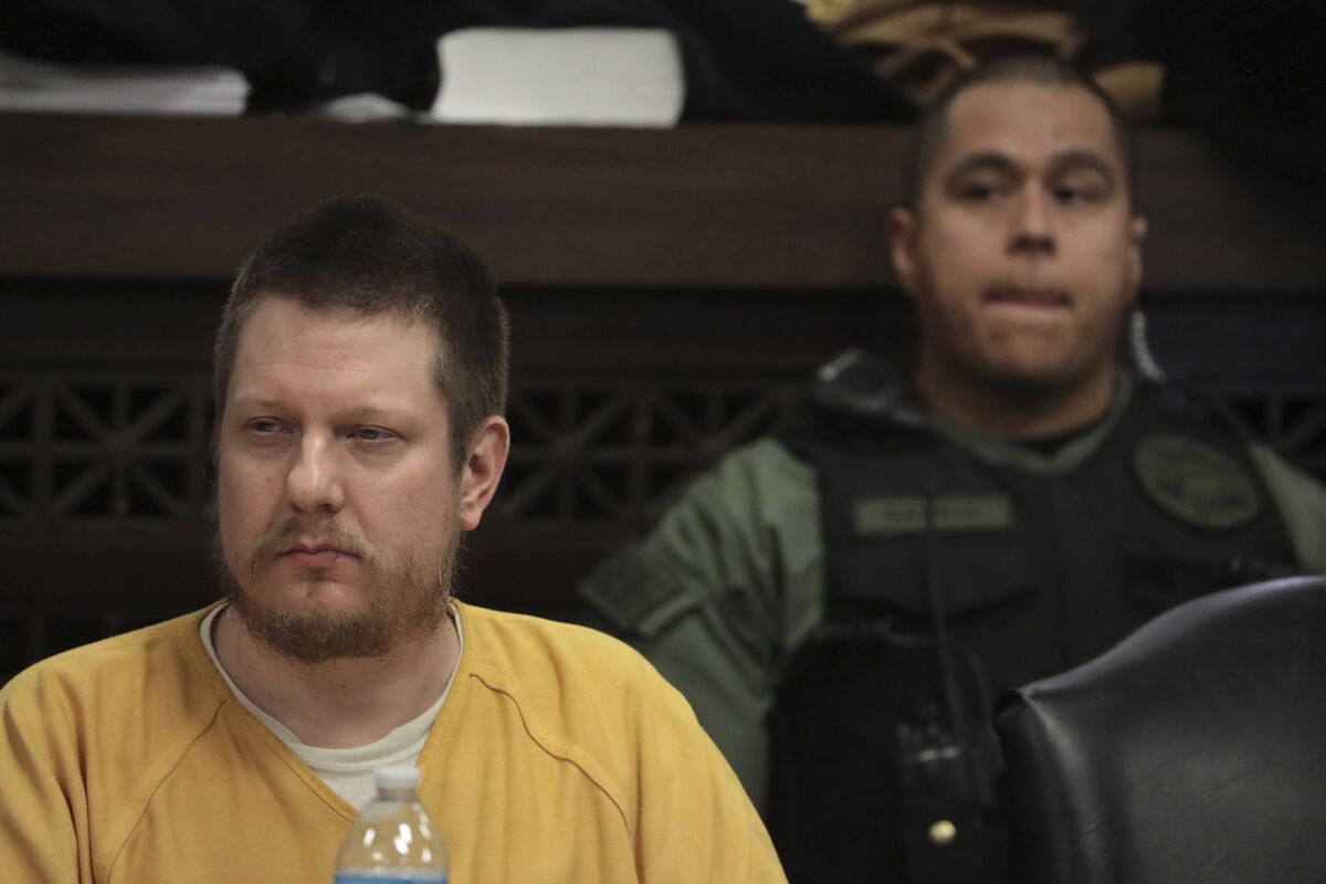 FILE - In this Jan. 18, 2019 file photo, former Chicago police Officer Jason Van Dyke, left, attends his sentencing hearing at the Leighton Criminal Court Building in Chicago, for the 2014 shooting of Laquan McDonald. Van Dyke, the former Chicago police officer imprisoned for the 2014 murder of Laquan McDonald is set to be released from prison next month after serving less than half of the 81-month sentence imposed three years ago. (Antonio Perez/Chicago Tribune via AP, Pool, File)