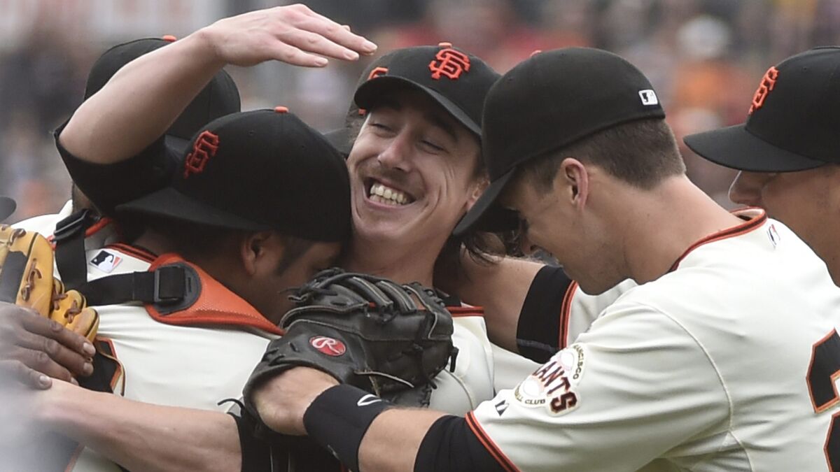 San Francisco Giants starter Tim Lincecum, center, smiles as he celebrates with his teammates after throwing a no-hitter in a 4-0 win over the San Diego Padres on Wednesday.