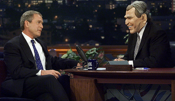 Former President George W. Bush, who at the time was the US Republican Presidential candidate and Texas Governor, speaks with host Jay Leno , who wears a George W. Bush mask on October 30, 2000, as Bush appears on the show one day before Halloween. The US general election was in November 2007.