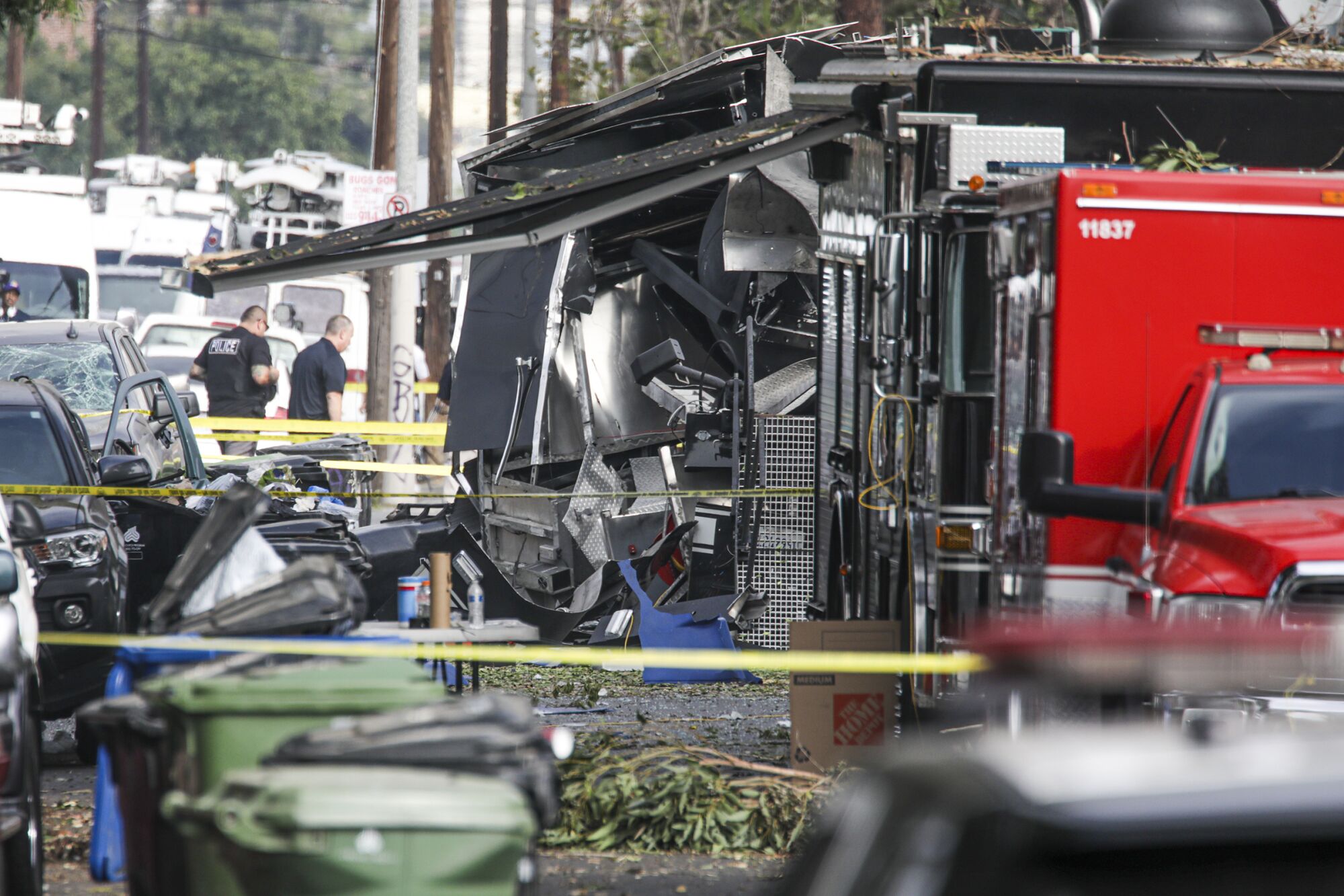 Police and federal investigators look over the scene of the fireworks blast in 2021.